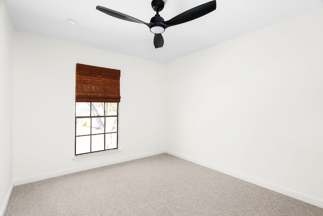 spare room featuring carpet floors and ceiling fan