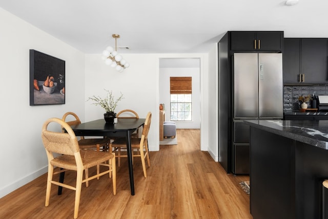 dining space featuring light hardwood / wood-style floors