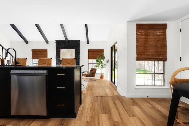 kitchen featuring light hardwood / wood-style floors, beam ceiling, dishwasher, and sink