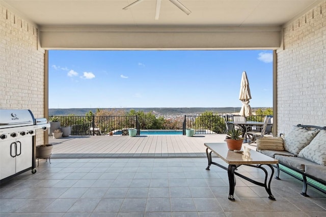 view of patio featuring ceiling fan