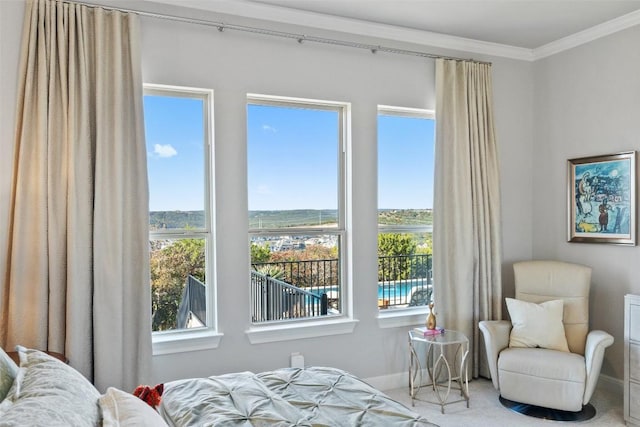 carpeted bedroom featuring multiple windows and ornamental molding