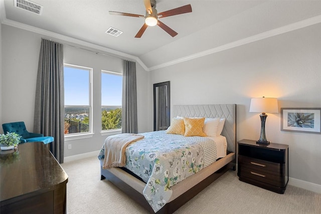 carpeted bedroom featuring ornamental molding, vaulted ceiling, and ceiling fan