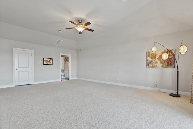 carpeted spare room featuring ceiling fan