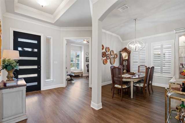 1745 Liguria Ct, Leander, TX 78641 - foyer entrance with arched walkways, dark wood-style floors, a chandelier, baseboards, and ornamental molding