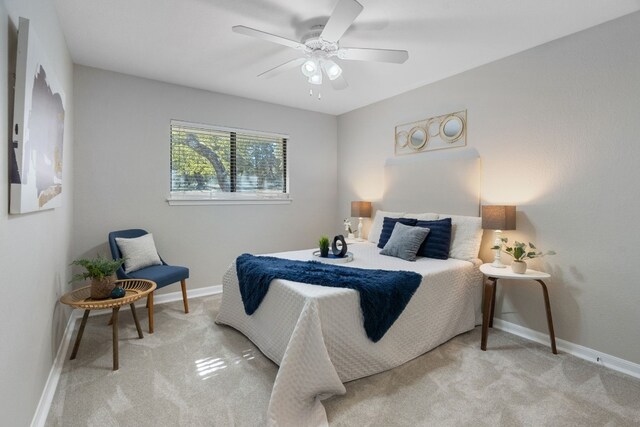 carpeted bedroom with ceiling fan