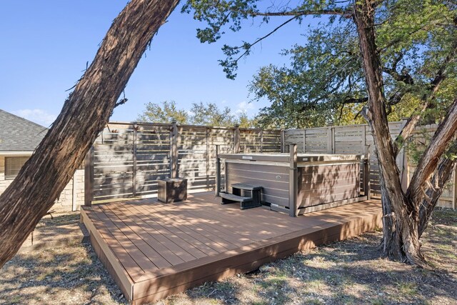 1043 Windmill Rd, Dripping Springs, TX 78620 - wooden terrace featuring a hot tub and a fenced backyard