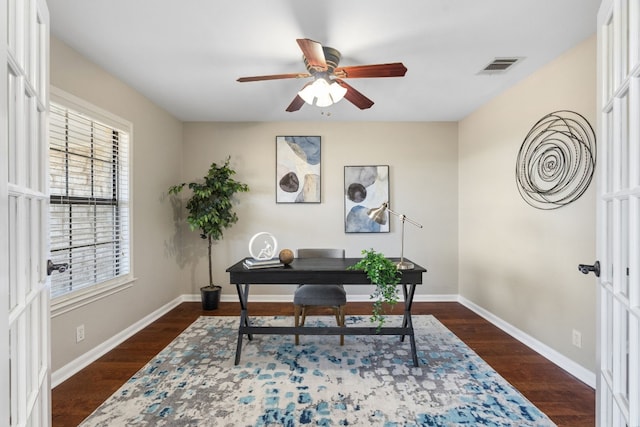 office area with dark wood-type flooring and ceiling fan