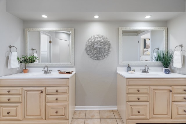 1043 Windmill Rd, Dripping Springs, TX 78620 - bathroom with two vanities, baseboards, tile patterned floors, and recessed lighting