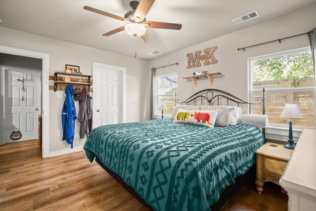 bedroom featuring hardwood / wood-style flooring and ceiling fan