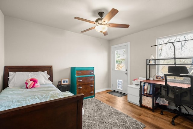 bedroom with ceiling fan and light wood-type flooring