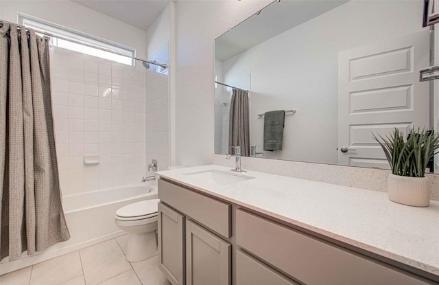 full bathroom with shower / bathtub combination with curtain, vanity, tile patterned floors, and toilet