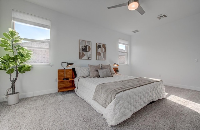 bedroom with light carpet and ceiling fan