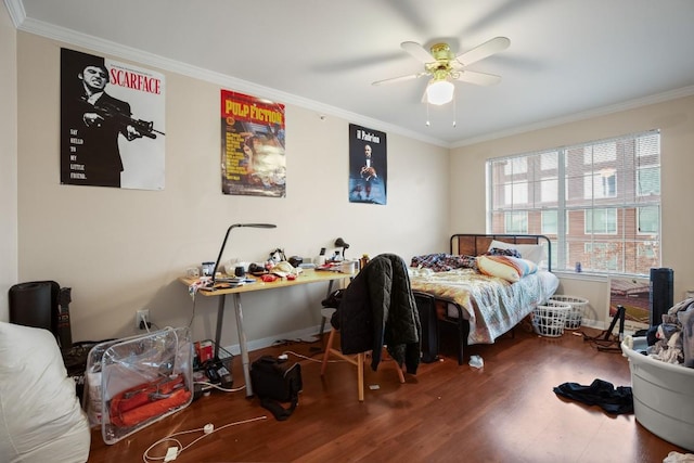 bedroom with crown molding, dark hardwood / wood-style floors, and ceiling fan