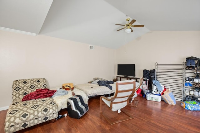 bedroom with vaulted ceiling, dark hardwood / wood-style floors, and ceiling fan