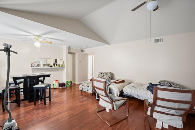 sitting room with dark wood-type flooring, ceiling fan, and lofted ceiling