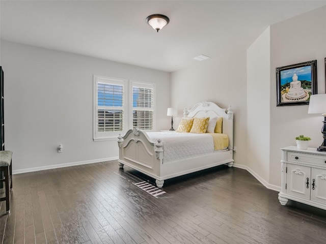 bedroom featuring dark hardwood / wood-style flooring