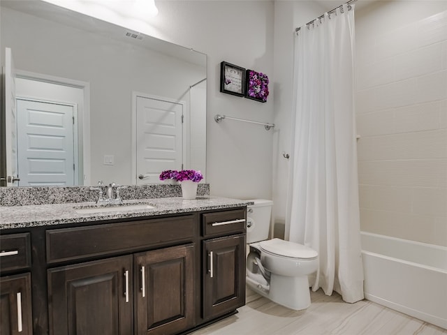 full bathroom featuring vanity, toilet, and shower / tub combo