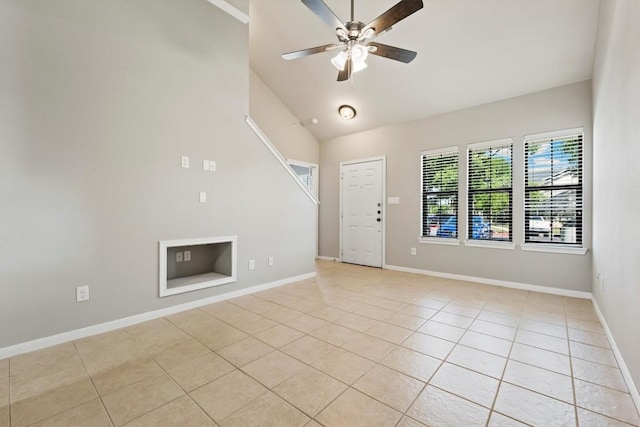 interior space featuring high vaulted ceiling and ceiling fan