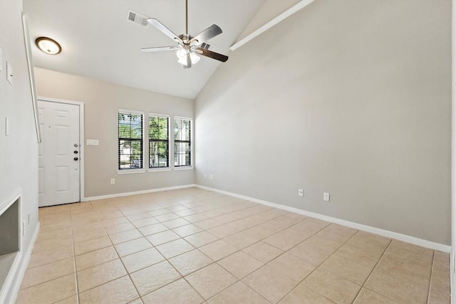 spare room featuring ceiling fan, high vaulted ceiling, and light tile patterned floors