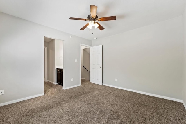 unfurnished bedroom featuring ceiling fan and carpet flooring