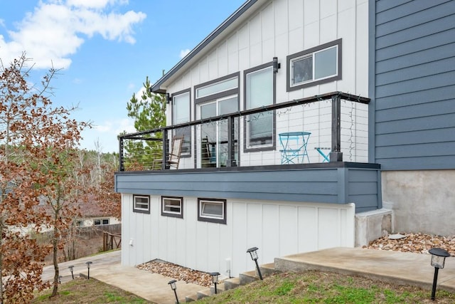 209 Kipahulu Dr, Bastrop, TX 78602 - view of home's exterior featuring a balcony and board and batten siding