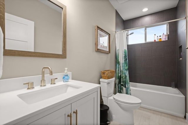 full bathroom with shower / bath combo, vanity, and toilet