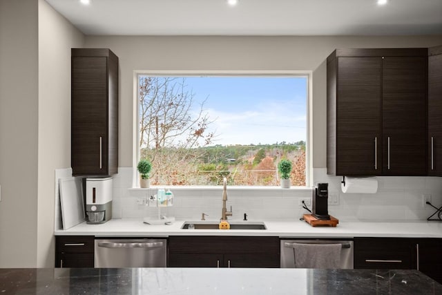 kitchen with decorative backsplash, a sink, stainless steel dishwasher, and dark brown cabinets