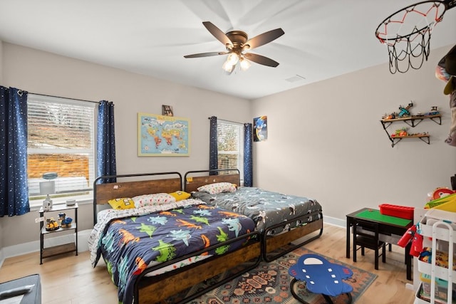 209 Kipahulu Dr, Bastrop, TX 78602 - bedroom with wood finished floors and ceiling fan