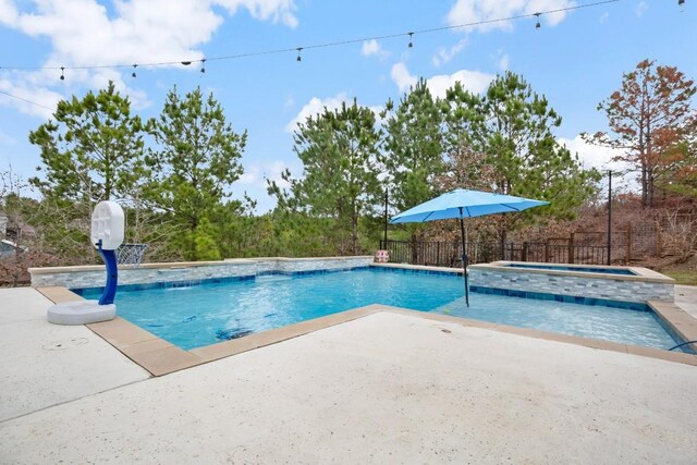 209 Kipahulu Dr, Bastrop, TX 78602 - view of pool featuring a patio and an in-ground hot tub