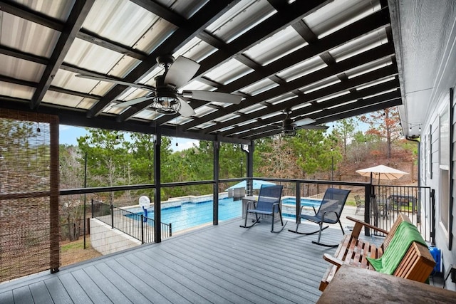 deck featuring an outdoor pool and ceiling fan