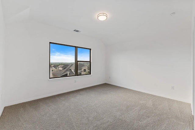 7605 Becasseau Dr, Austin, TX 78738 - empty room featuring vaulted ceiling, carpet floors, and baseboards
