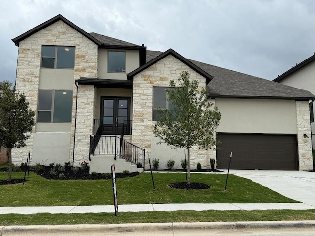 7605 Becasseau Dr, Austin, TX 78738 - view of front of home with roof with shingles, stone siding, concrete driveway, stucco siding, and a front lawn