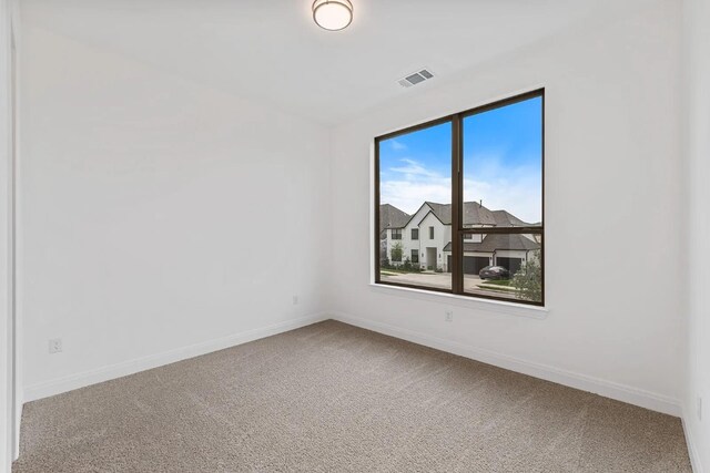 7605 Becasseau Dr, Austin, TX 78738 - empty room with carpet, visible vents, and baseboards