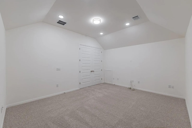 7605 Becasseau Dr, Austin, TX 78738 - interior space featuring light colored carpet, lofted ceiling, visible vents, and recessed lighting