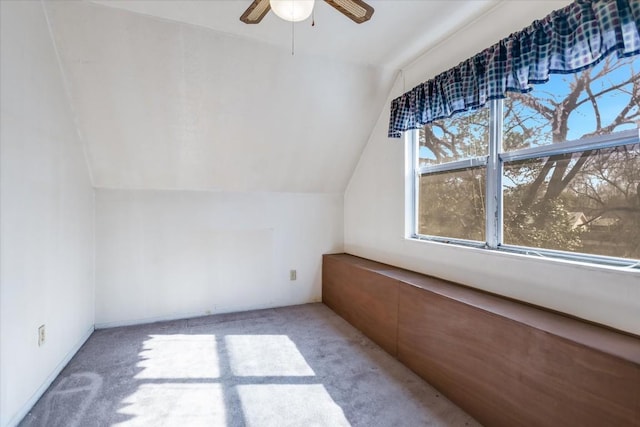 bonus room featuring lofted ceiling, light carpet, and ceiling fan