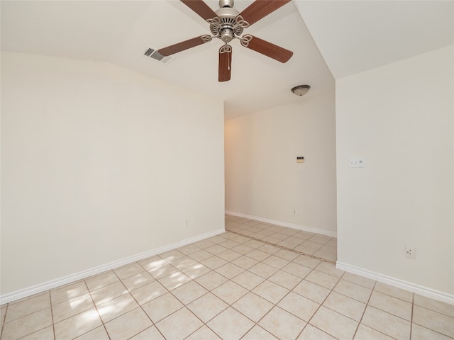 unfurnished room featuring light tile patterned flooring, ceiling fan, and vaulted ceiling