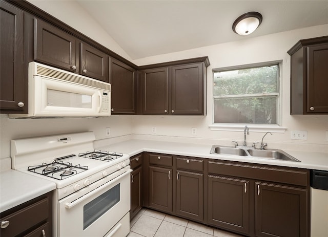 1416 Thibodeaux Dr, Round Rock, TX 78664 - kitchen with white appliances, a sink, dark brown cabinetry, lofted ceiling, and light countertops