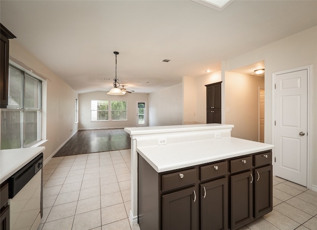 1416 Thibodeaux Dr, Round Rock, TX 78664 - kitchen featuring white dishwasher, light tile patterned floors, open floor plan, vaulted ceiling, and light countertops