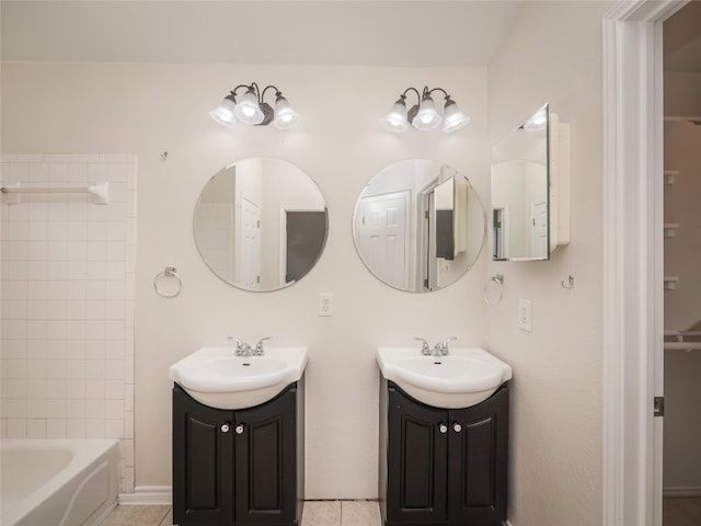 1416 Thibodeaux Dr, Round Rock, TX 78664 - full bath featuring two vanities, tile patterned floors, and washtub / shower combination