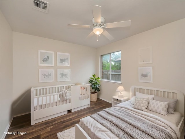 1416 Thibodeaux Dr, Round Rock, TX 78664 - bedroom with dark wood-type flooring, baseboards, and ceiling fan