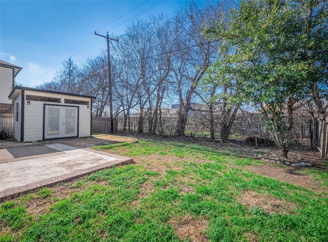 1416 Thibodeaux Dr, Round Rock, TX 78664 - view of yard featuring a patio, french doors, and an outbuilding