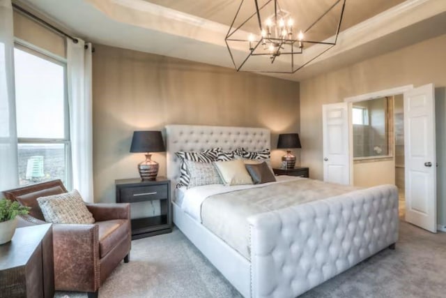 bedroom with a raised ceiling and light carpet