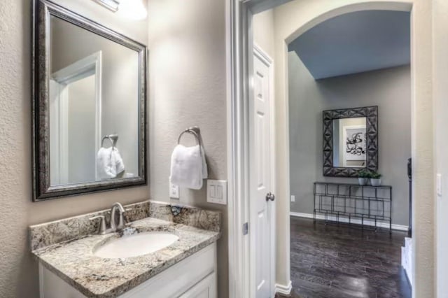 bathroom featuring wood-type flooring and vanity