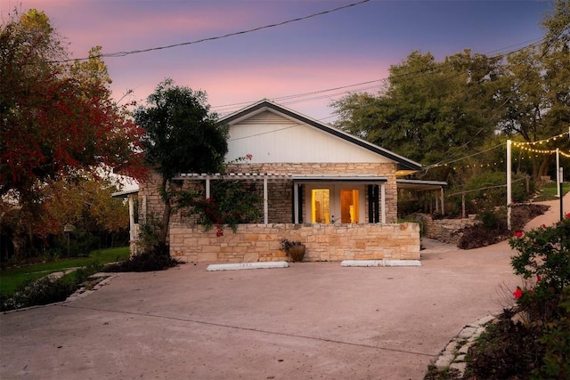 view of back house at dusk