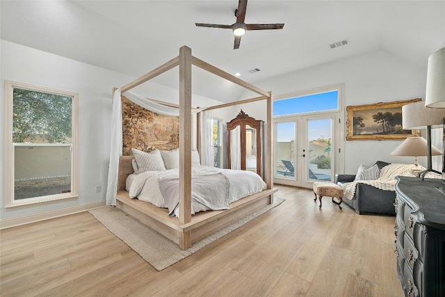 bedroom featuring lofted ceiling, light hardwood / wood-style flooring, ceiling fan, access to outside, and french doors