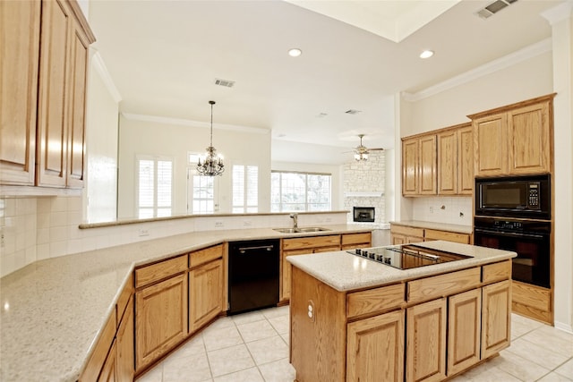 kitchen with a kitchen island, kitchen peninsula, sink, ornamental molding, and black appliances