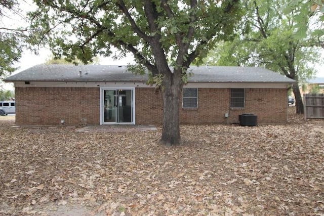 rear view of house with central AC