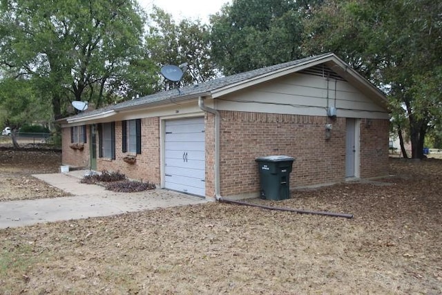 view of side of home featuring a garage