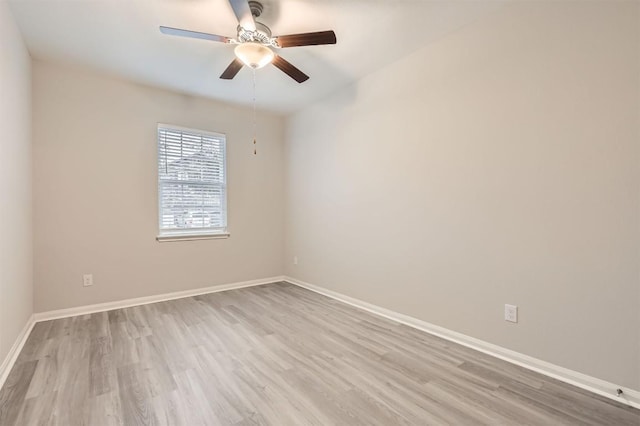 spare room with ceiling fan and light hardwood / wood-style floors