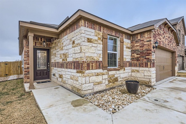 view of exterior entry with a garage